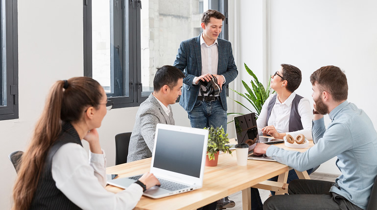 Group young entrepreneurs discusing How can Communication Coaching Help You